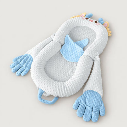Blue dragon soothing patting Yorkie bed