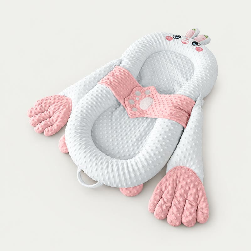 Pink bunny soothing patting Yorkie bed
