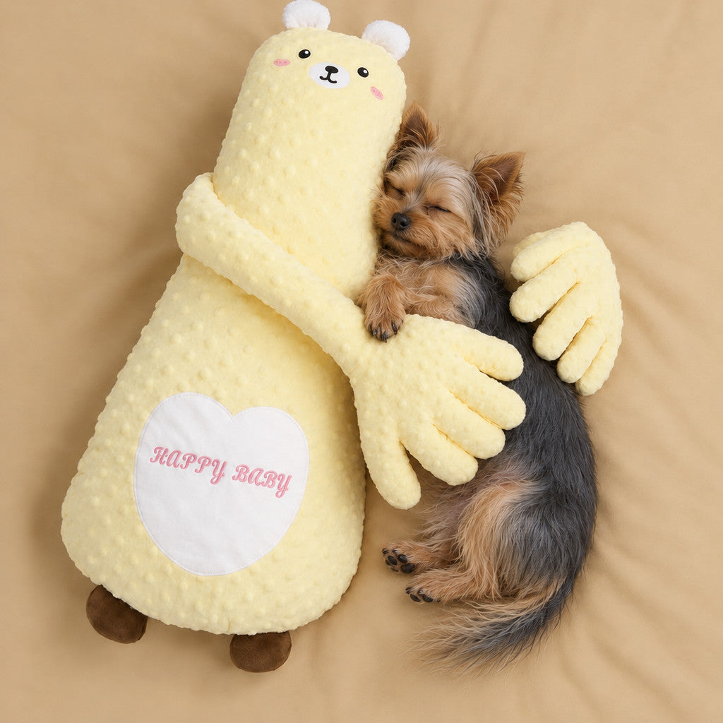 Yorkie sleeping in the arms of the yellow bear patting pillow